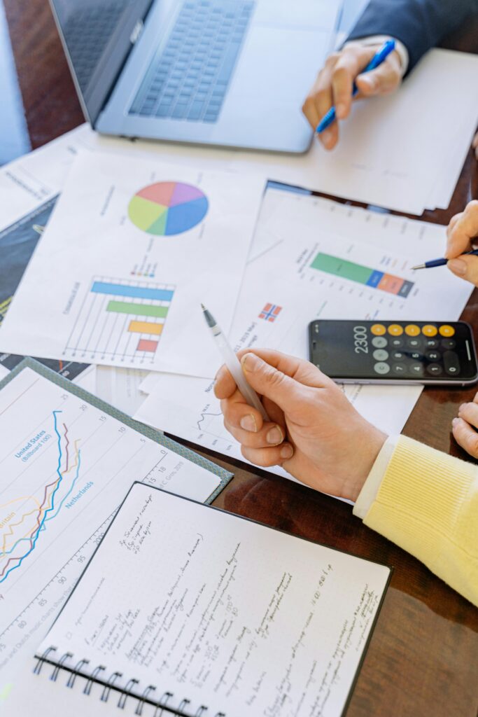 pexels-photo-5816298-5816298 A close-up of businesspeople analyzing financial data and charts during a meeting.